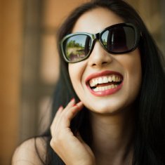 Happy woman wearing sunglasses