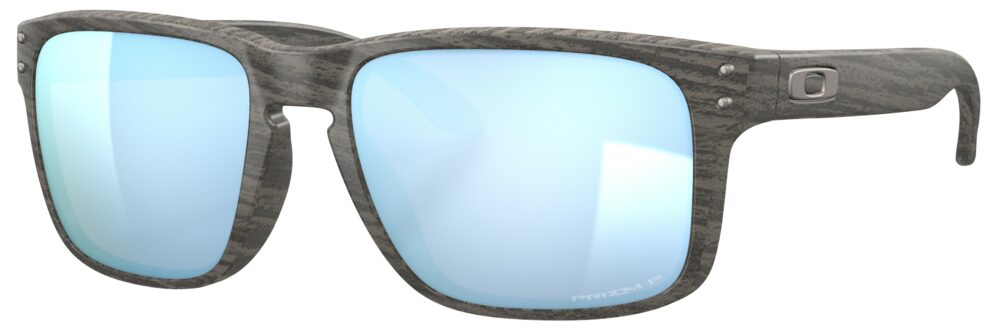 Oakley Holbrook Sunglasses in a Woodgrain with Prizm Deep Water Polarized Lenses. Angled Left